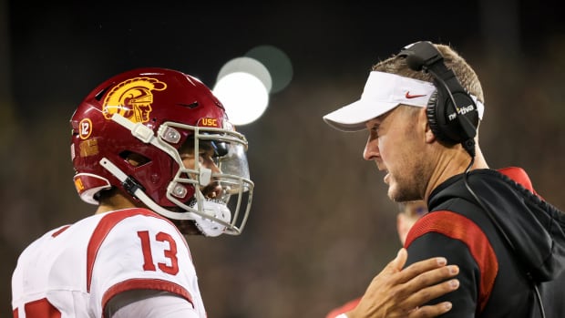 USC Trojans quarterback Caleb Williams (13) talks with USC Trojans head coach Lincoln Riley during the first half of the game against No. 6 Oregon Ducks on Saturday, Nov. 11, 2023, at Autzen Stadium in Eugene, Ore.  